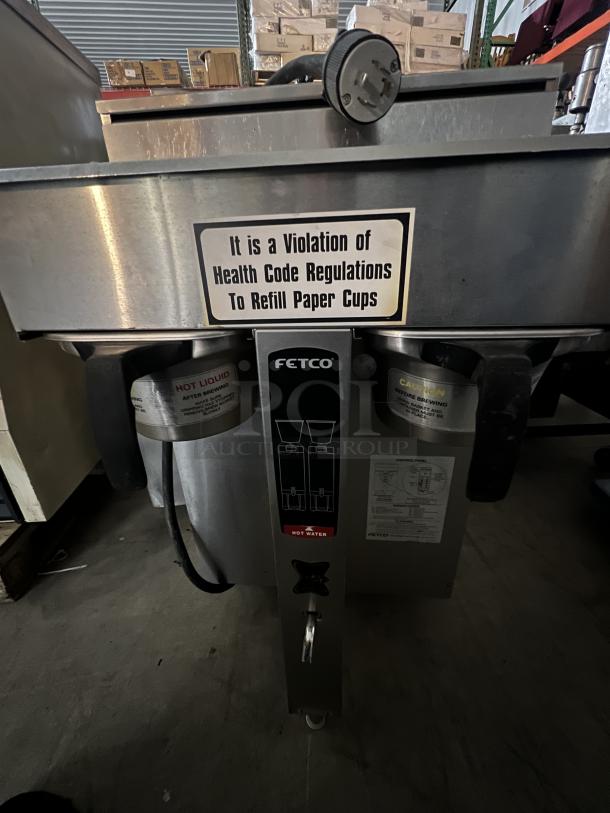 Fetco CBS-2042e Double Coffee/Tea Brewer, stainless steel, 19x16x34.5 inches, visible warning label on health code compliance.