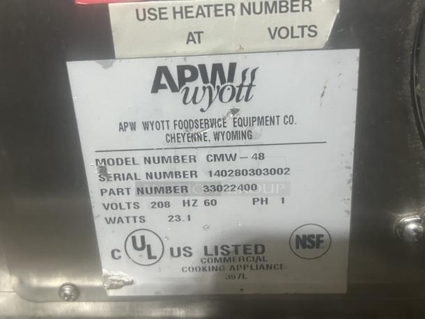 APW Wyott Cheese Melter, Model CMW-40, 44-1/2"x17"x15-1/2", UL and NSF listed, visible label with serial and part numbers.