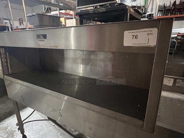 APW Wyott Cheese Melter, Model CMW-40, 44-1/2"x17"x15-1/2", stainless steel, visible auction tag, used condition.