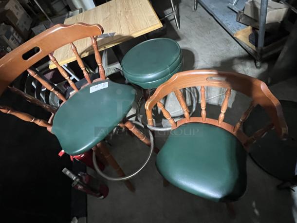 Set of green cushioned barstools and chairs with wooden spindles. Includes price tag label. In good condition.