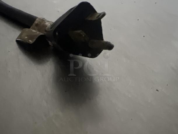 Damaged power cord of a blast chiller on a flat surface. Chiller is not tested, dimensions 56 x 34 x 33.