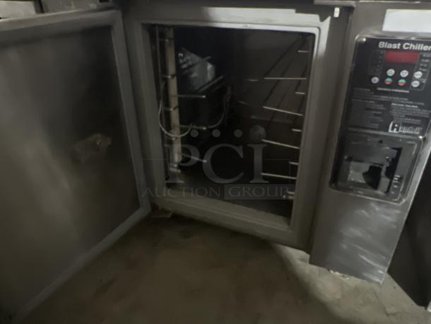 Industrial blast chiller, stainless steel, open door, control panel visible, untested condition, 56 x 34 x 33 inches.