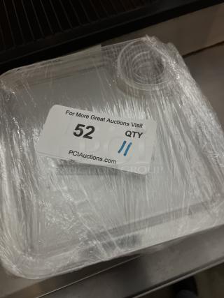 Pack of 11 appetizer trays with wine glass holder, wrapped in plastic. Auction label indicates item number 52.