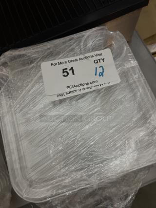 12 appetizer/snack trays with wine glass holders, wrapped in plastic, marked with label "51" indicating auction lot.