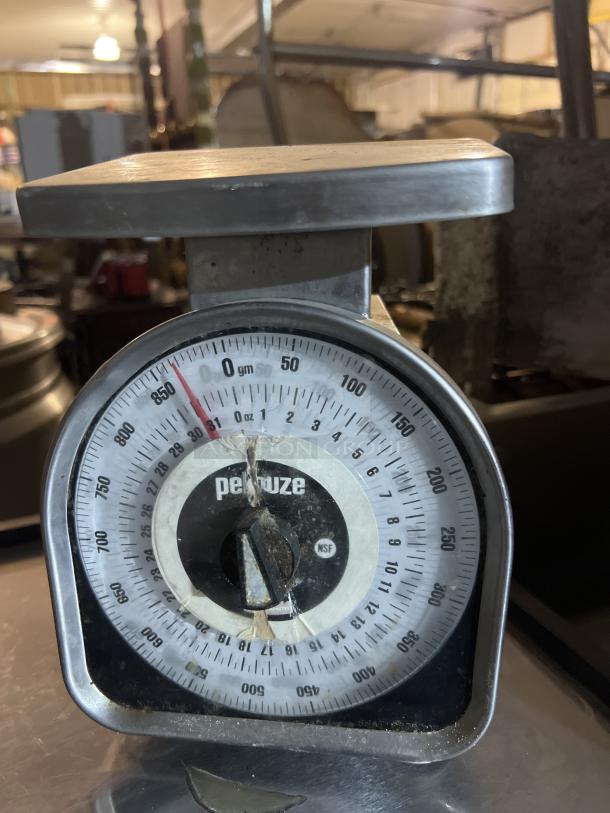 Pelouze gram/ounce scale with analog dial, stainless steel top, visible wear and tear, NSF certified.