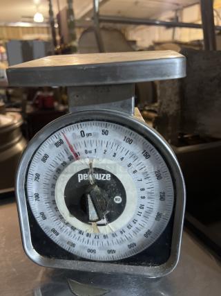 Pelouze gram/ounce scale with analog dial, stainless steel top, visible wear and tear, NSF certified.