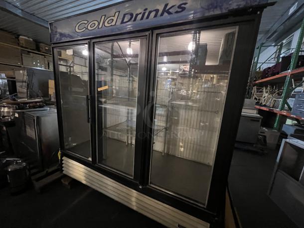 True 3-Door Refrigerated Cooler, 78"x30"x79.5", glass doors, metal shelving, "Cold Drinks" signage, used condition.