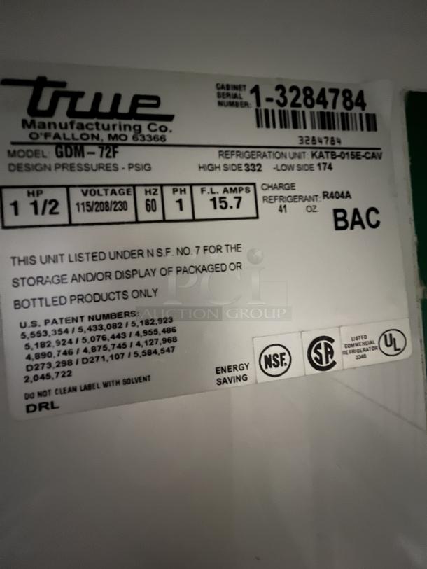 True 3-Door Refrigerated Cooler label, model GDM-72F, lists dimensions, voltage, refrigerant details, energy certifications.