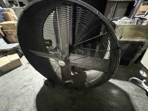 45” industrial big fan with metal frame and wheels, in used condition. Perfect for large spaces, enhances airflow efficiency.