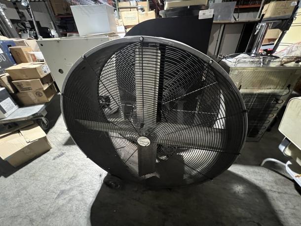 45" industrial fan with metal blades and protective grille, in used condition. Features visible labeling on the front.