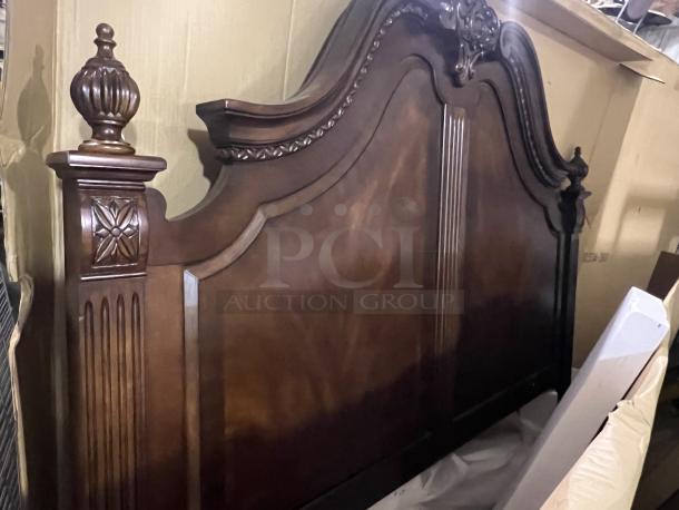 Heavy king-sized headboard with carved wood details, ornate posts, and elegant finishing. In good condition.
