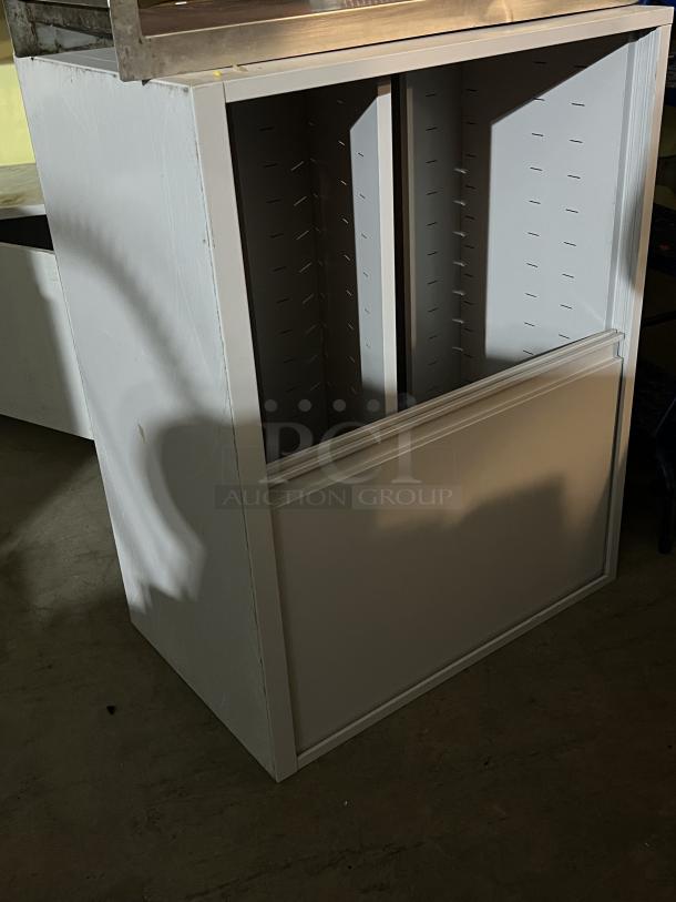 Cubicle style wall mount metal shelf, white finish, minor wear, open design with adjustable shelving slots.