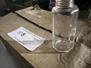 Clear glass salt and pepper shaker on a cardboard box, no cap, condition appears used. Auction label indicates lot 1/5.