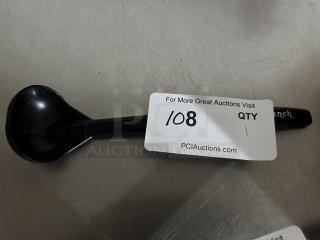 Black plastic ranch ladle, used condition, with slight wear. Tag reads "For More Great Auctions Visit PCIauctions.com."