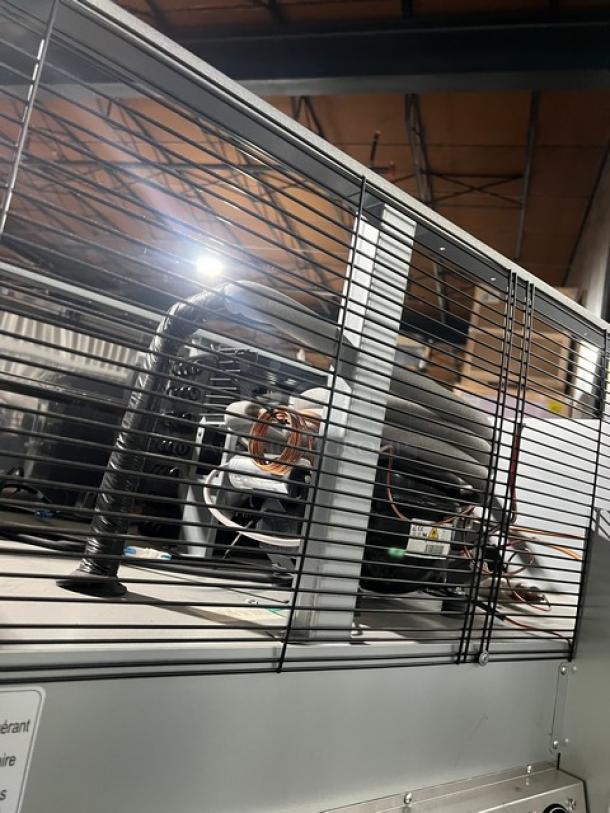 Brand new Blue Air BSR49THC 2019 stainless steel 2-door reach-in refrigerator, with poly coated wired rack, on casters.