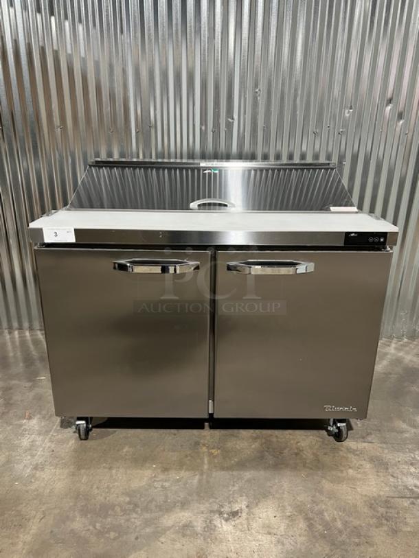 Brand new Blue Air 2019 stainless steel 2-door refrigerated prep table, model BLPT48HC, with cutting board, food pan, and wire rack.