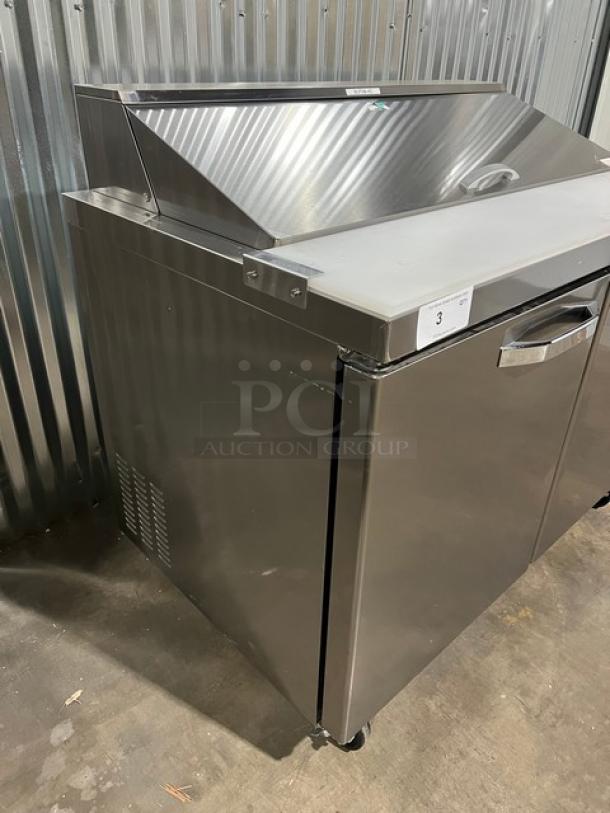 Brand new Blue Air BLPT48HC refrigerated prep table, stainless steel, 2-door, cutting board, polycarbonate food pan, on casters.