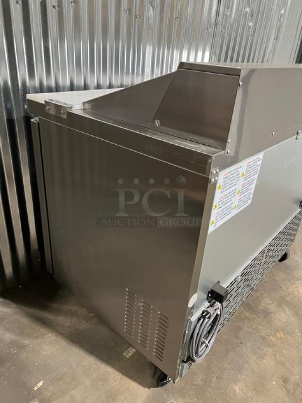 Stainless steel Blue Air BLPT48HC refrigerated prep table, new condition, with cutting board, food pan, and casters.