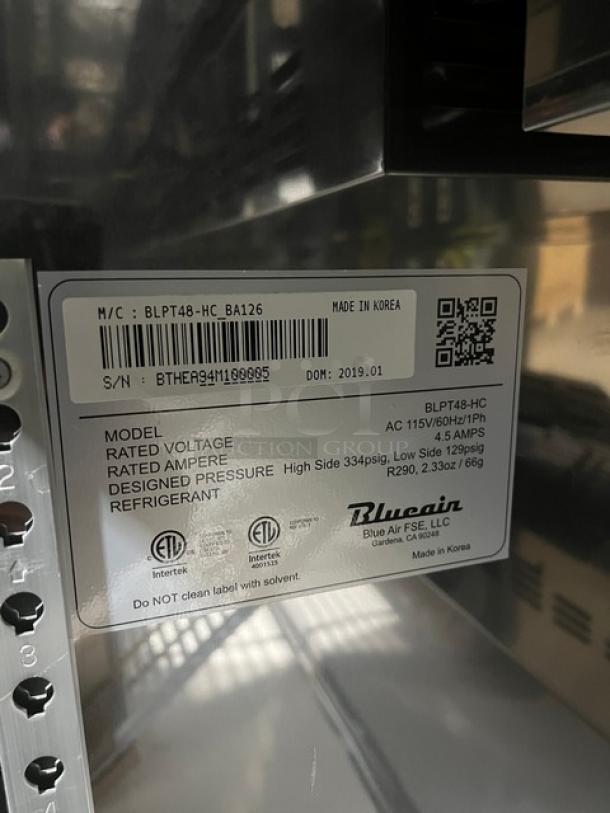 Brand new Blue Air BLPT48-HC refrigerated prep table label, 2019, stainless steel, 2 doors, 115V. Includes food pans and rack.