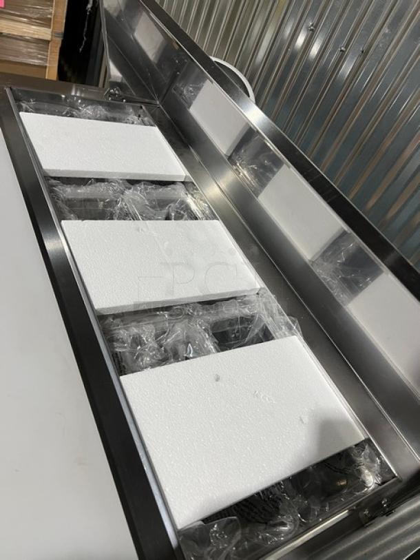 Blue Air BLPT48HC stainless steel 2-door refrigerated prep table, brand new, with cutting board and food pan, on casters.