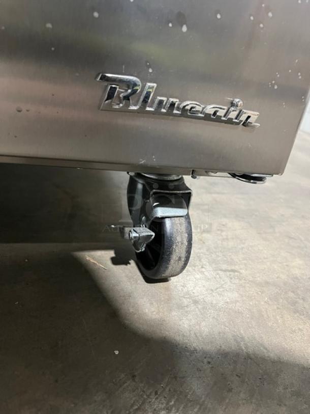 Blue Air stainless steel refrigerated prep table model BLPT48HC on caster wheels, brand logo visible.