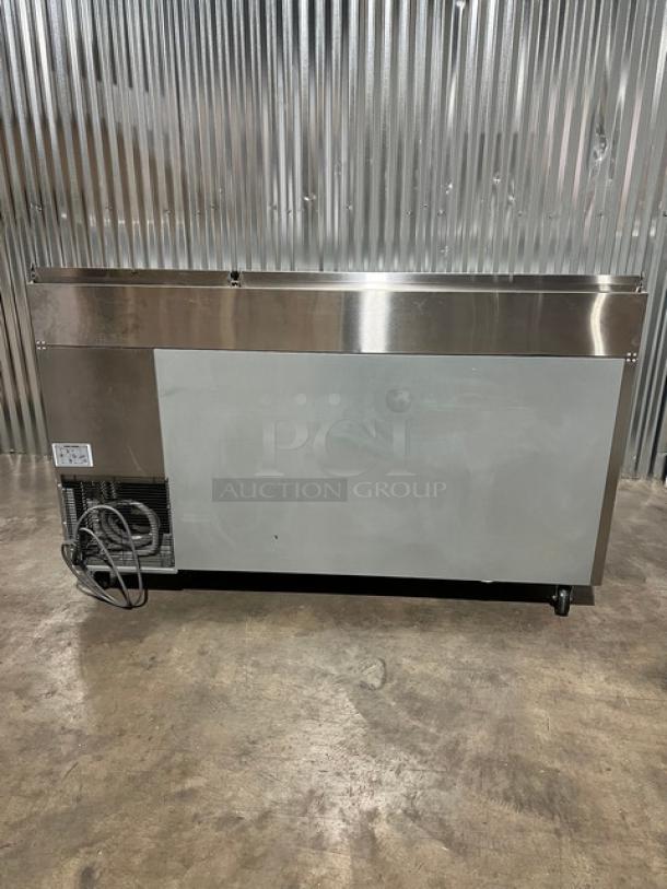 Blue Air stainless steel 2-door refrigerated pizza prep table, model BAPP67, new condition with casters and cutting board.