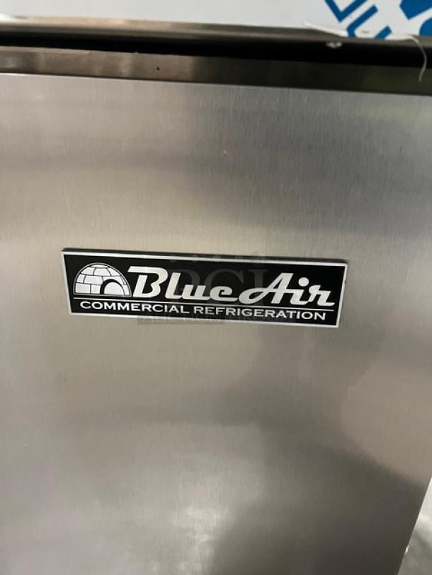 Brand new Blue Air BAPP67 stainless steel 2-door refrigerated pizza prep table with cutting board and polycarbonate food pan.