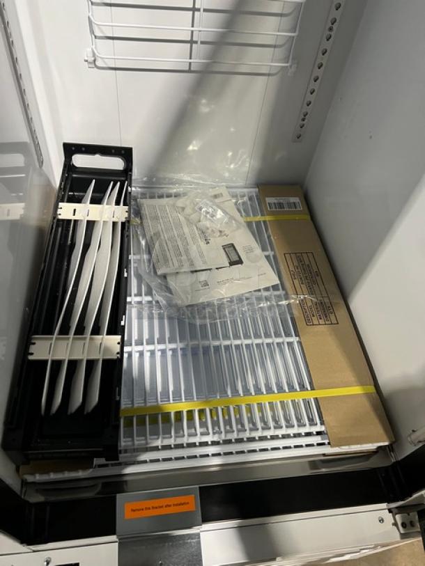 Brand new Blue Air BGM23W-HC reach-in merchandiser refrigerator with poly coated wire rack, on casters, 115V 1 phase.