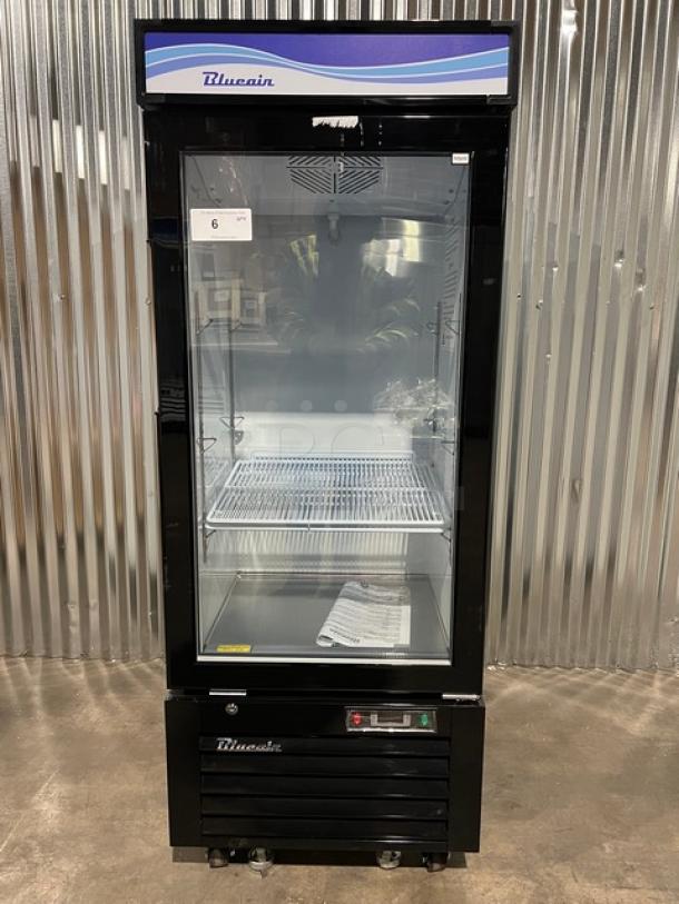 Brand new Blue Air reach-in merchandiser refrigerator, black and white, model BKGM12-HC, single glass swing door, on casters.