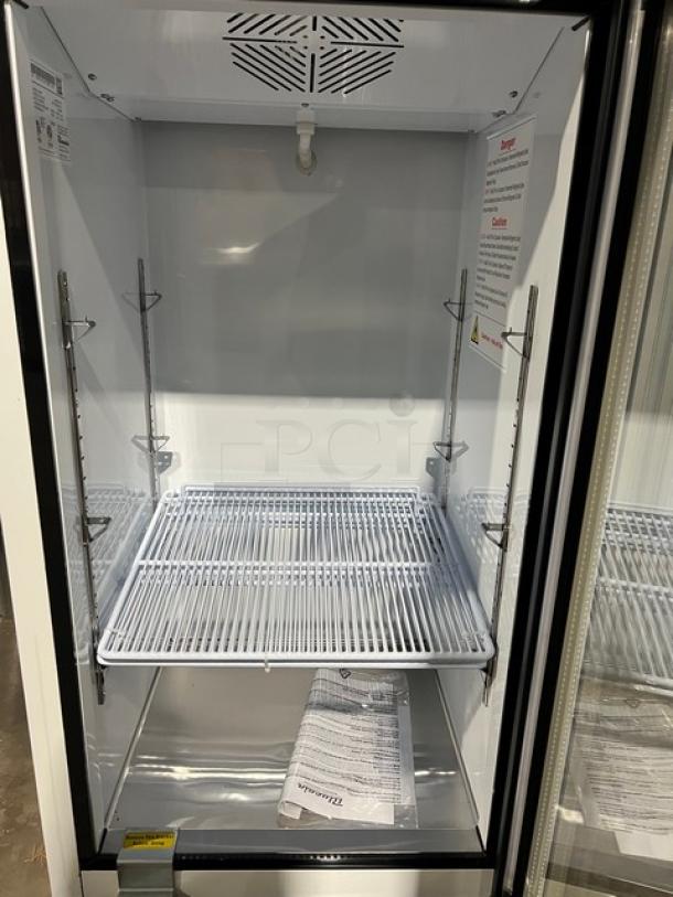 Blue Air BKGM12HC swing door reach-in merchandiser fridge, black/white. New with poly coated rack, on casters, 115V, 1 phase.