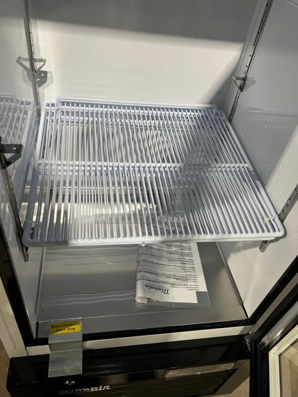 Blue Air BKGM12HC single glass door merchandiser refrigerator, black and white, includes poly-coated wire rack, new condition.