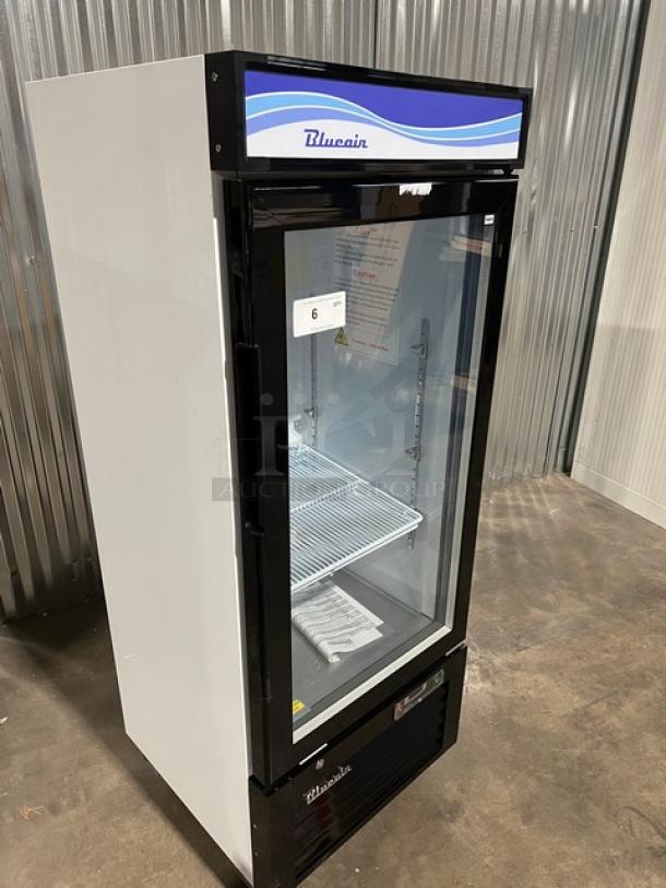 Brand new Blue Air BKGM12HC merchandiser refrigerator with single glass door, poly-coated wired rack, on casters.