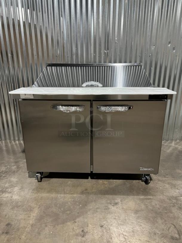 Brand new Blue Air 2022 stainless steel 2-door refrigerated prep table, model BLMT48HC, with cutting board and food pan.