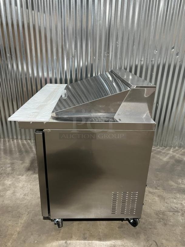 Brand new Blue Air BLMT48HC refrigerated prep table, stainless steel, 48" wide, with cutting board and food pan, on casters.