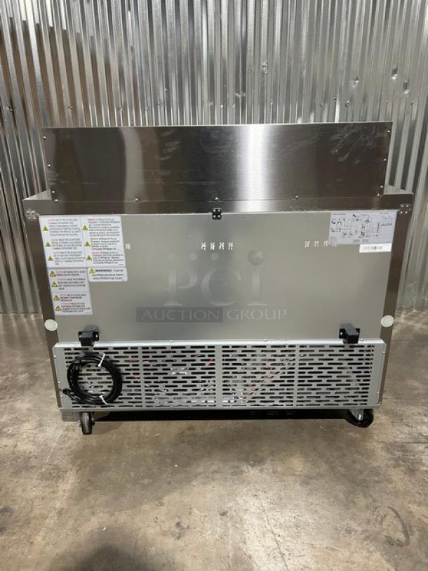 Brand new Blue Air BLMT48-HC refrigerated prep table, stainless steel, dual doors, 48" wide, on casters, with labels.