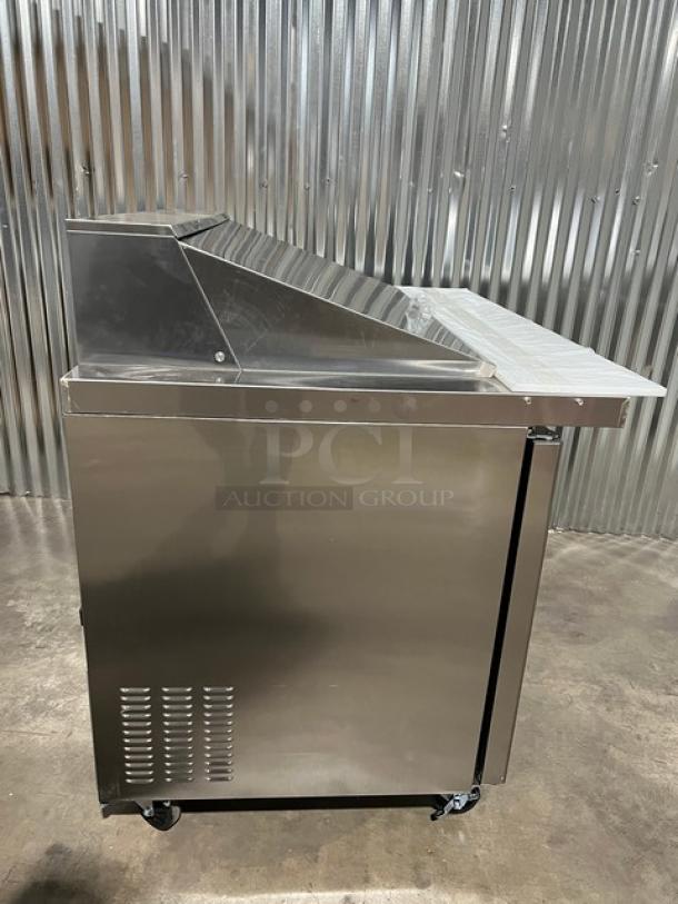 2022 Blue Air Model BLMT48HC refrigerated bain marie style prep table, stainless steel, 2-door, with cutting board and food pan, on casters.