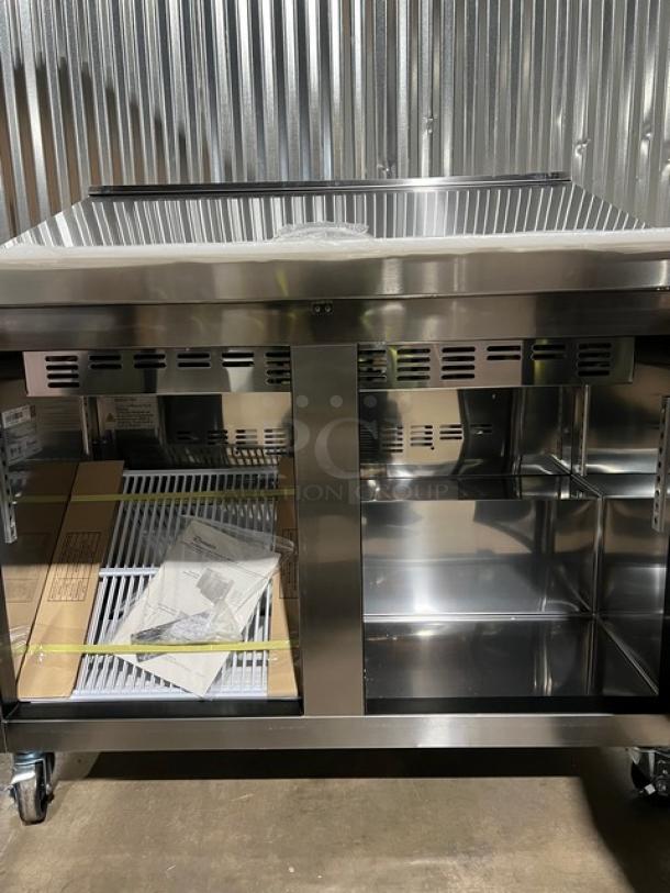 Stainless steel Blue Air 2-door refrigerated prep table, model BLMT48HC, with cutting board, polycarbonate food pan, 48-inch, on casters.