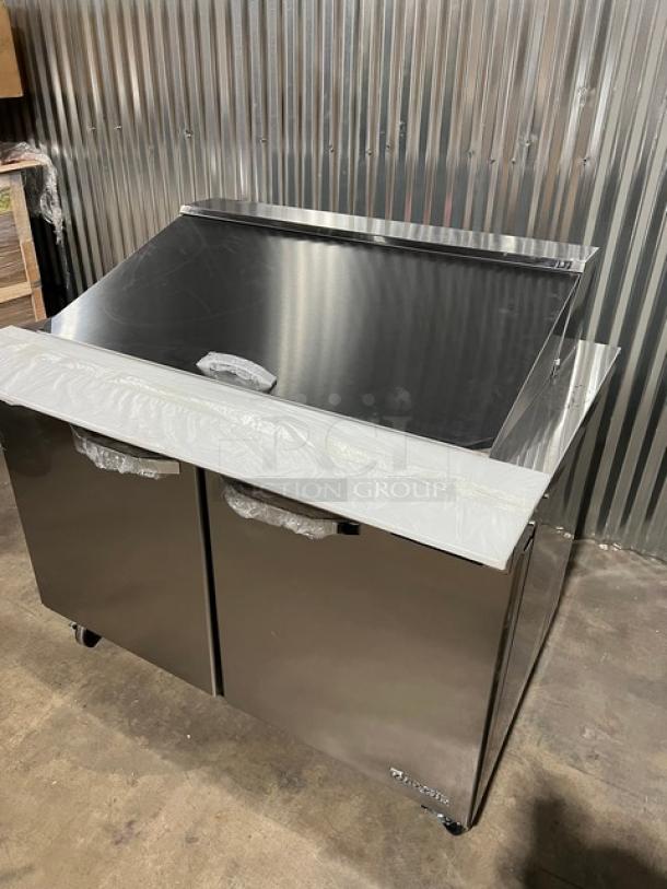Brand new Blue Air 2022 stainless steel 48" refrigerated prep table, BLMT48-HC model, with cutting board and food pan.