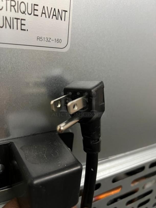 Close-up of the power plug on a Blue Air BLMT48HC refrigerated bain marie prep table, 115V, 1 Phase.