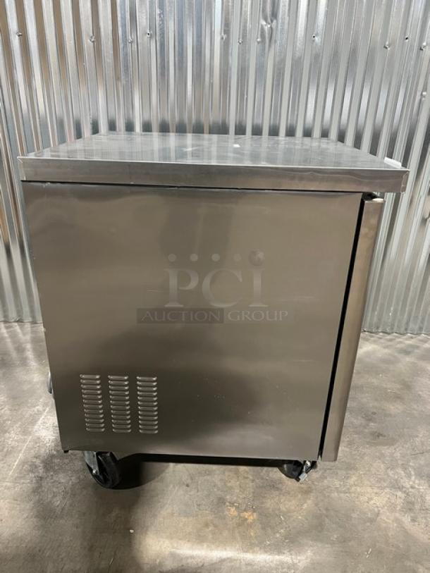 Blue Air BAUR28 stainless steel single door undercounter refrigerator, brand new, with poly-coated wired rack, on casters.