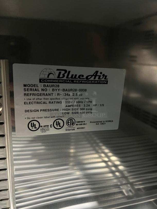 Blue Air BAUR28 stainless steel undercounter refrigerator, brand new, with poly coated wire rack, 115V, on casters.