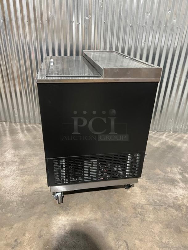 Brand new Blue Air BGF36B black glass froster/bottle cooler, 36", stainless steel top, slide-back lid, on casters.