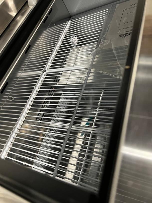 Blue Air BGF36B glass froster/bottle cooler, brand new, shows poly-coated wired rack, stainless steel worktop; on casters.