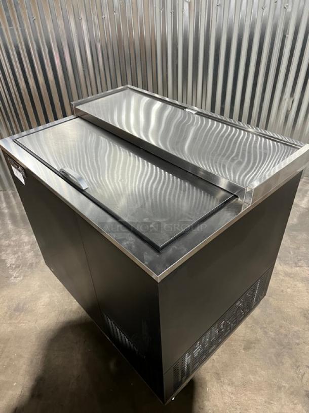Brand new Blue Air BGF36B 36" glass froster/bottle cooler, black with stainless steel worktop, slide-back lid, on casters.