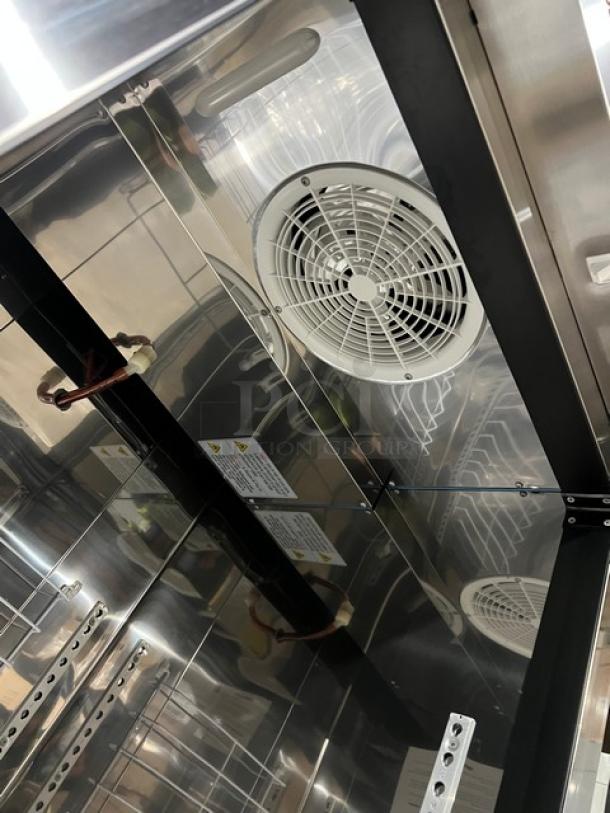 Brand new Blue Air BSF23HC commercial stainless steel freezer interior, with poly coated wired rack, vents, and casters.