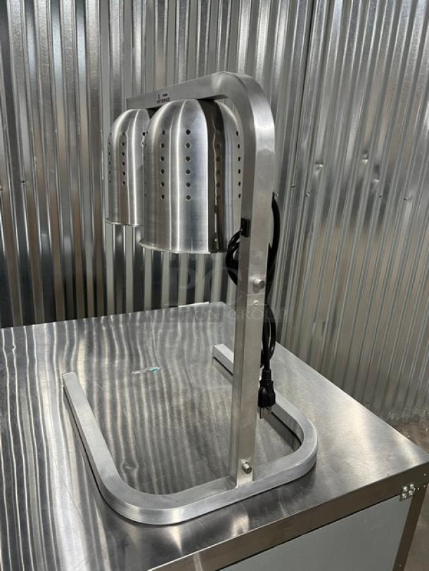 Brand new Blue Air BWL500 stainless steel countertop heat lamp with dual infrared shatter-proof bulbs, 120V, on legs.