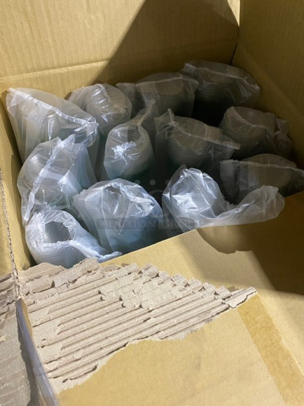 Mixed pallet of commercial kitchenware in original packaging, including compostable cups, wine flutes, plates, and more.