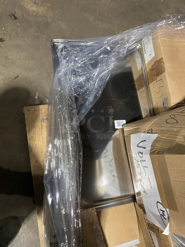 Mixed pallet with G.E.T. Evolution Series plate covers, Vollrath Traex salt shakers, and Super Pan V lids. New in boxes.