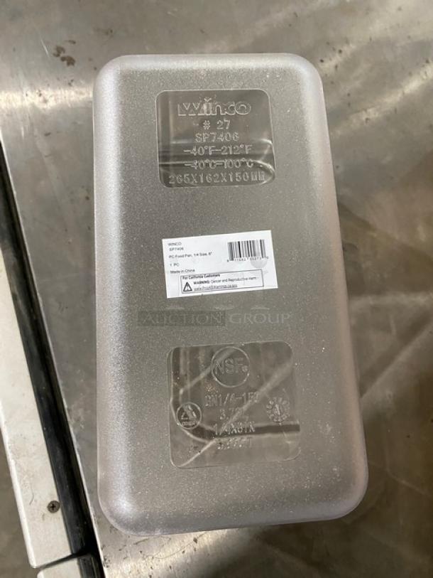 Brand new Winco SP7406/SP7400C clear polycarbonate 1/4-size 6" deep food pan with slotted lid. Markings: NSF, model, temperature range.