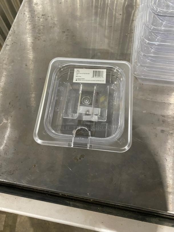 Brand new Winco polycarbonate 1/6-size food pan, 2.5" deep, with slotted lid. Model SP7602/SP7500C. Barcode on lid.